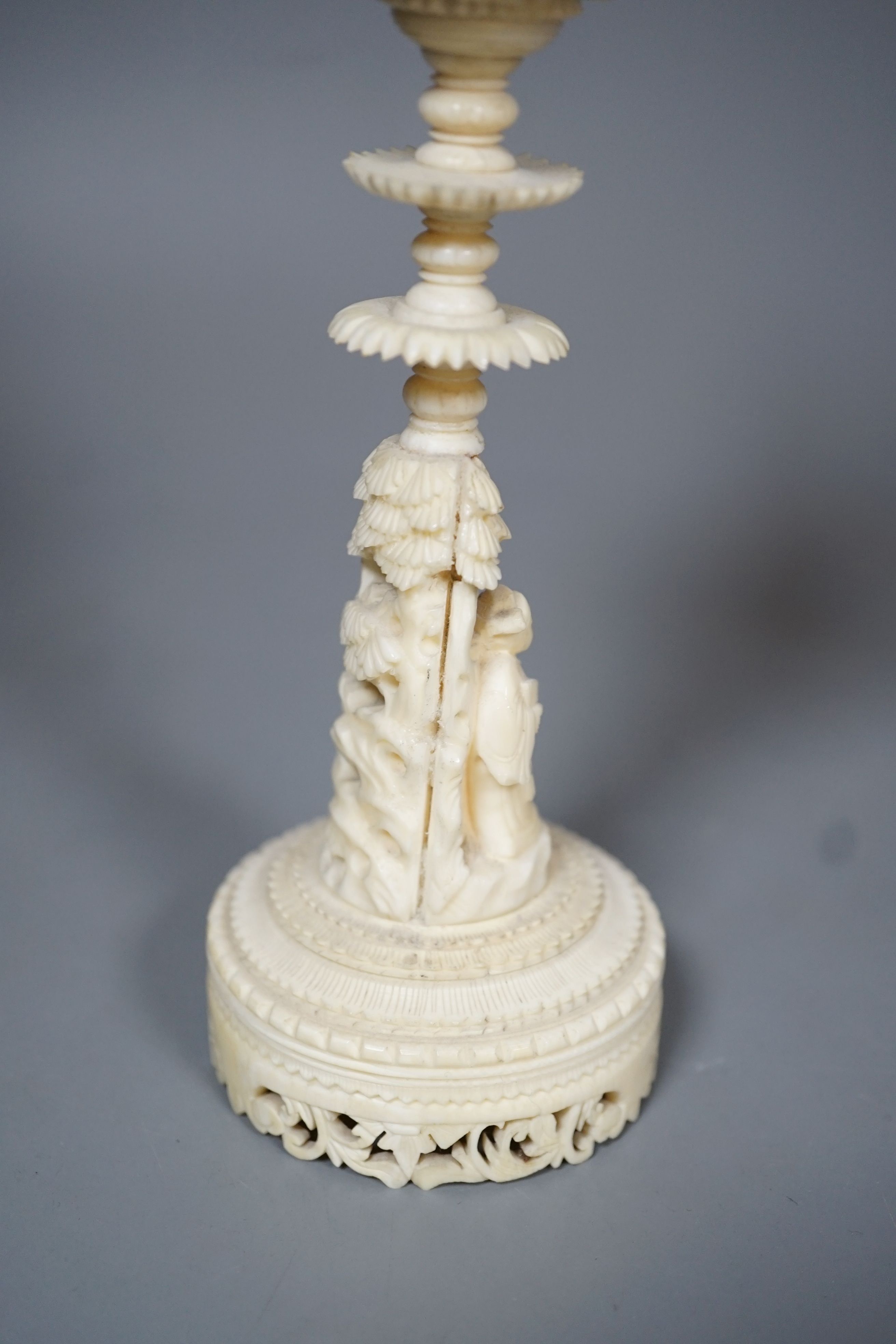 An early 20th century Chinese carved ivory concentric puzzle ball on stand 27cm